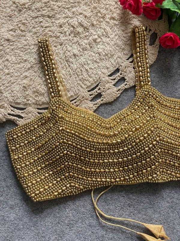 SLEEVELESS BLOUSE